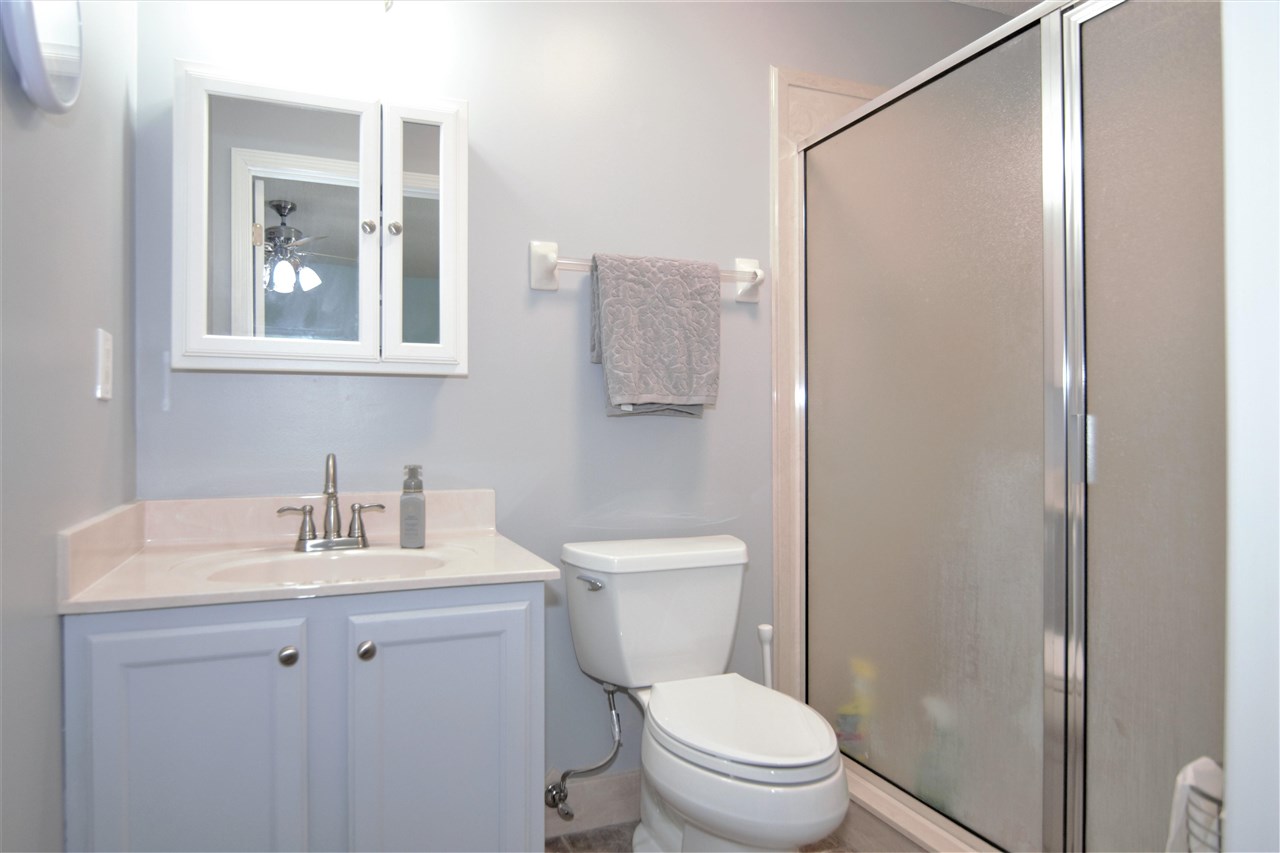 8517 Davidson Road Olive Branch, MS 38654 - Photo 20 of 24 a bathroom with a toilet sink vanity and mirror