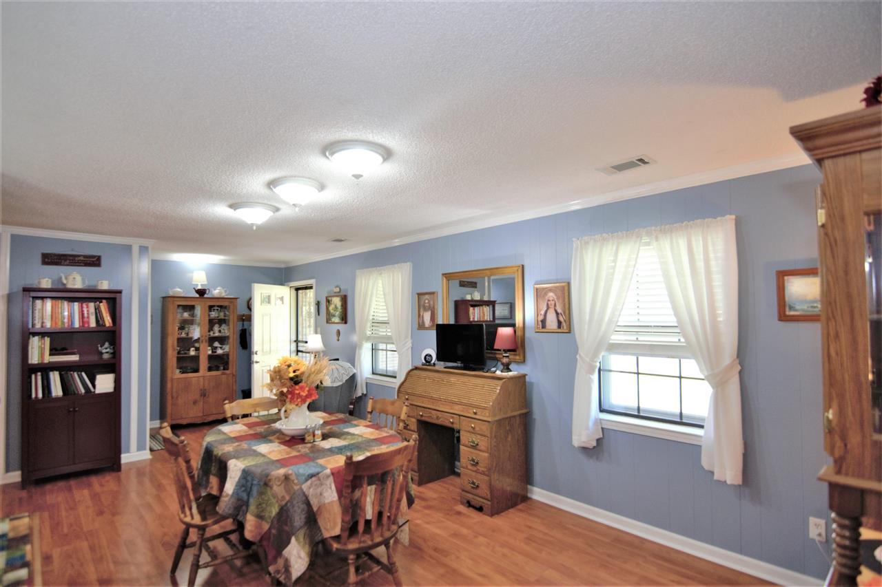 8517 Davidson Road Olive Branch, MS 38654 - Photo 3 of 24 a living room with furniture a bookshelf and a window