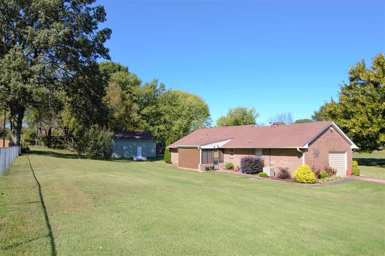 8517 Davidson Road Olive Branch, MS 38654 - Photo 22 of 24 a front view of house with yard and trees in the background