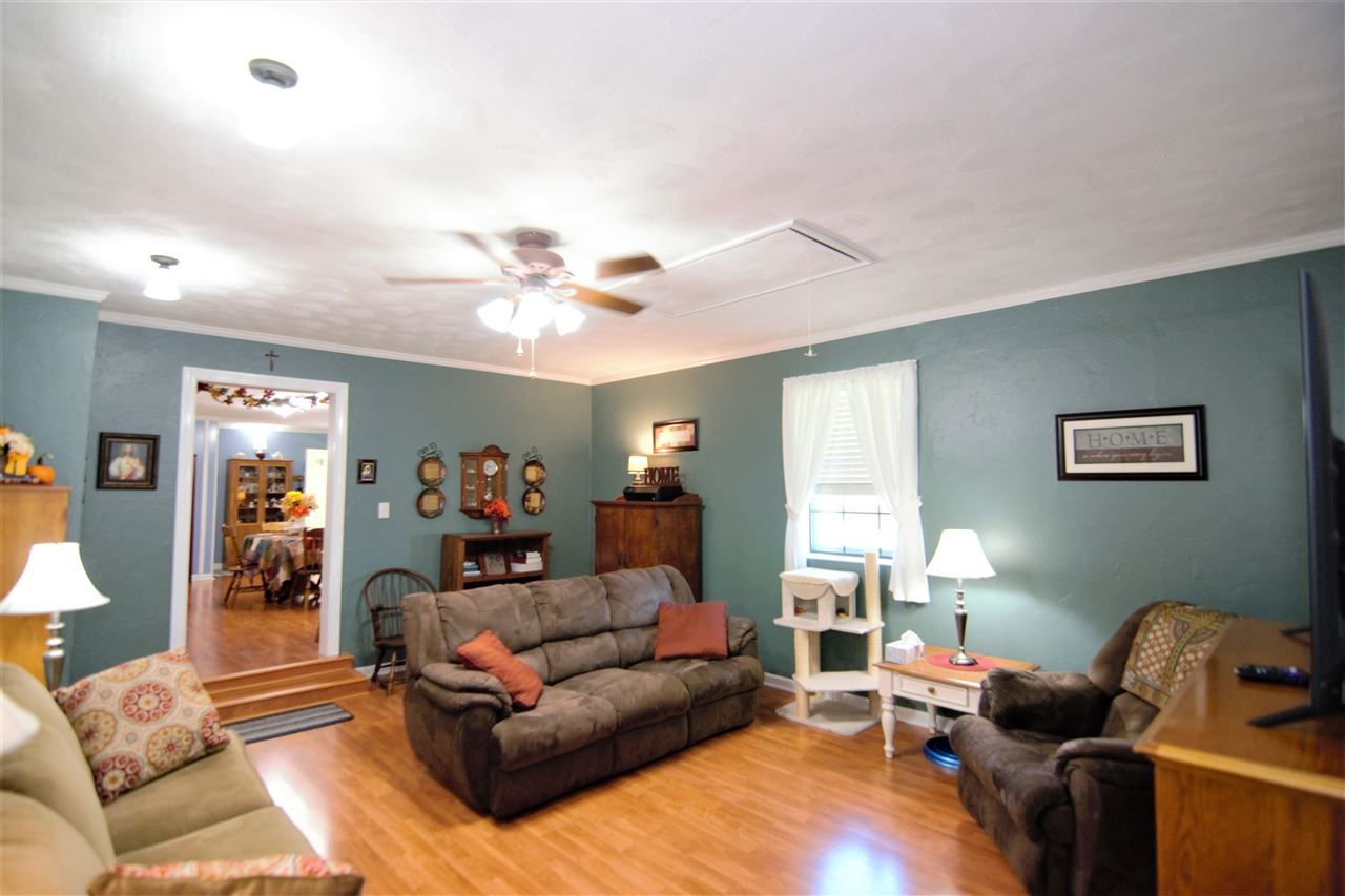 8517 Davidson Road Olive Branch, MS 38654 - Photo 5 of 24 a living room with furniture and a chandelier