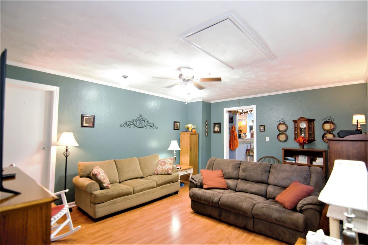 8517 Davidson Road Olive Branch, MS 38654 - Photo 6 of 24 a living room with furniture and a flat screen tv