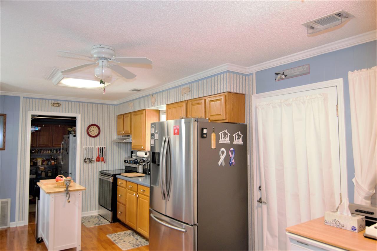 8517 Davidson Road Olive Branch, MS 38654 - Photo 8 of 24 a kitchen with stainless steel appliances granite countertop a refrigerator and a sink