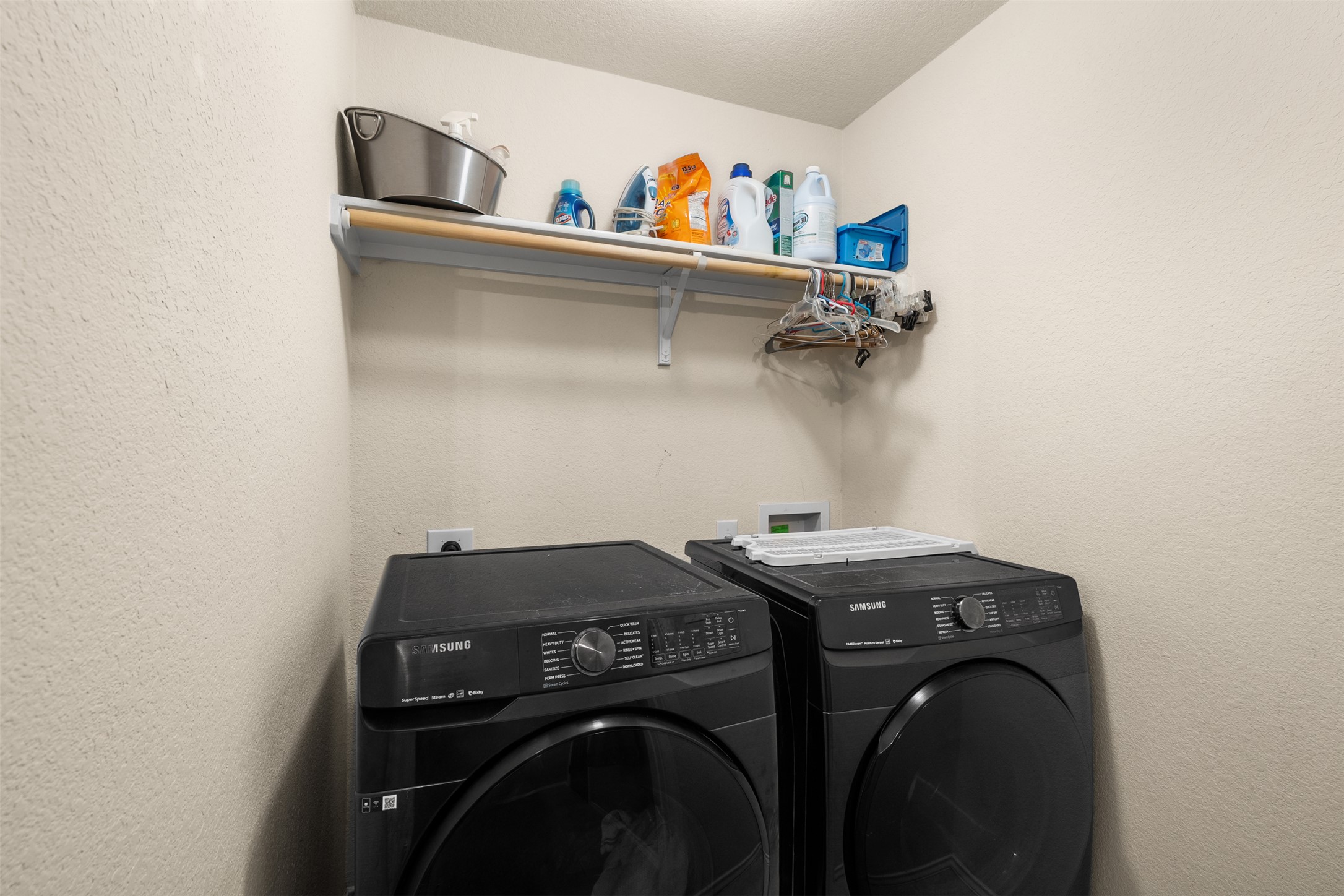137 Barn Owl Loop Leander, TX 78641 - Photo 6 of 36 a utility room with dryer and washer