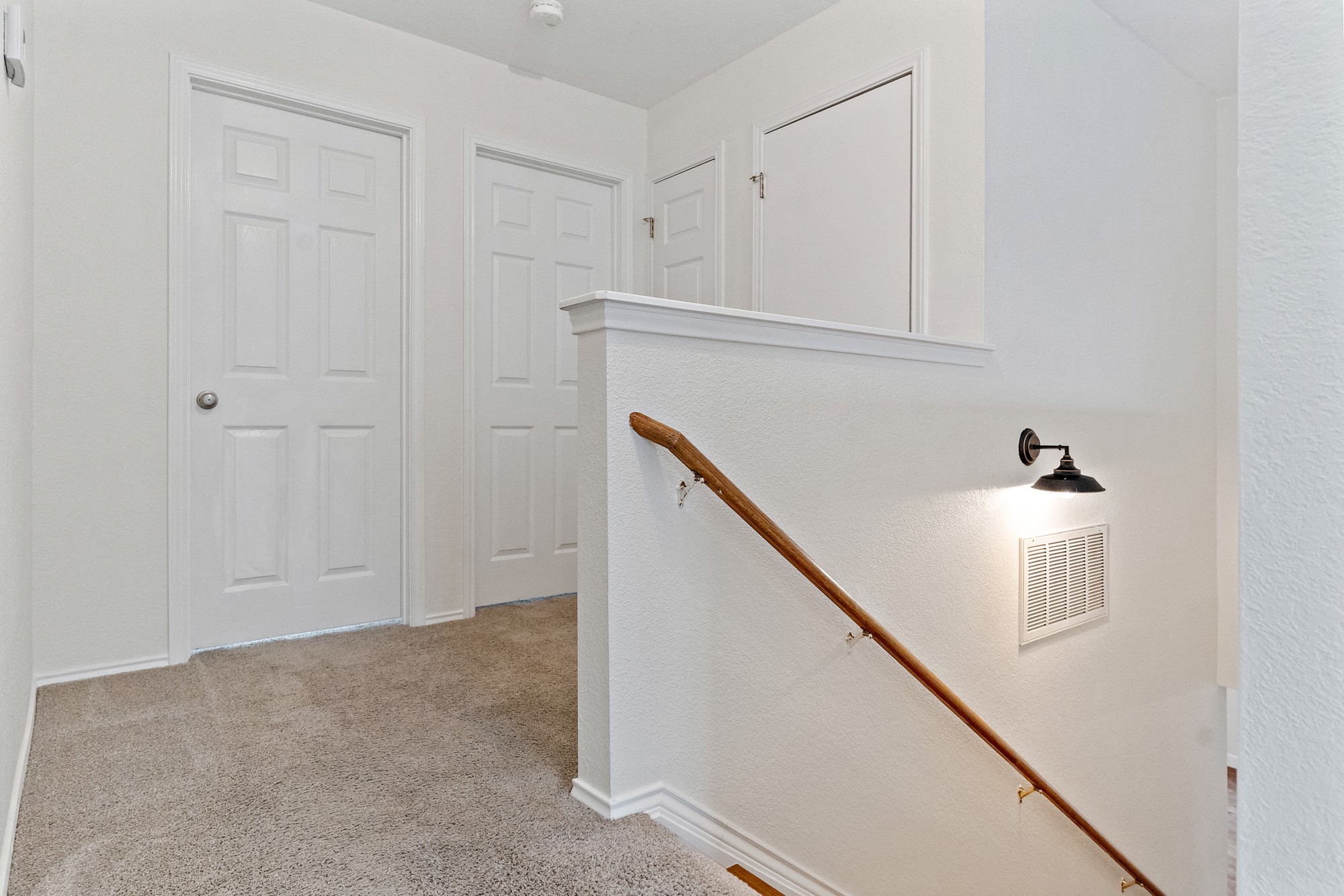 321 Nicole Way Bastrop, TX 78602 - Photo 11 of 32 Hall with an upstairs landing and light colored carpet