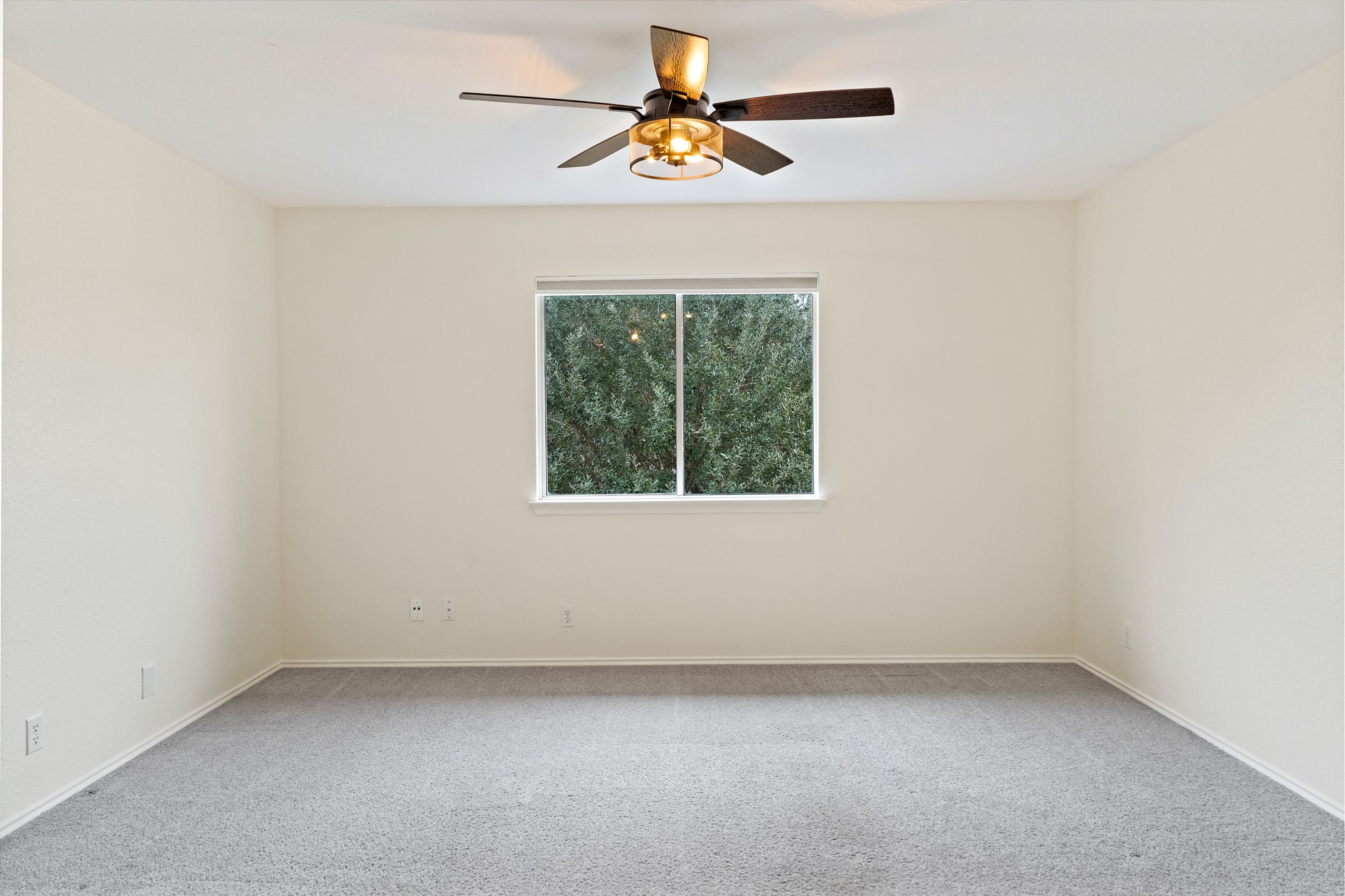 321 Nicole Way Bastrop, TX 78602 - Photo 14 of 32 Unfurnished room featuring light colored carpet and a ceiling fan