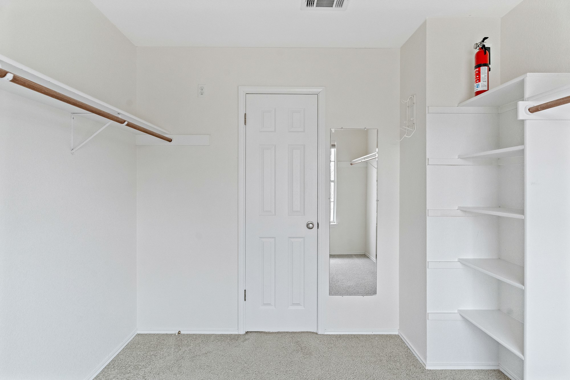 321 Nicole Way Bastrop, TX 78602 - Photo 20 of 32 Walk in closet with light carpet