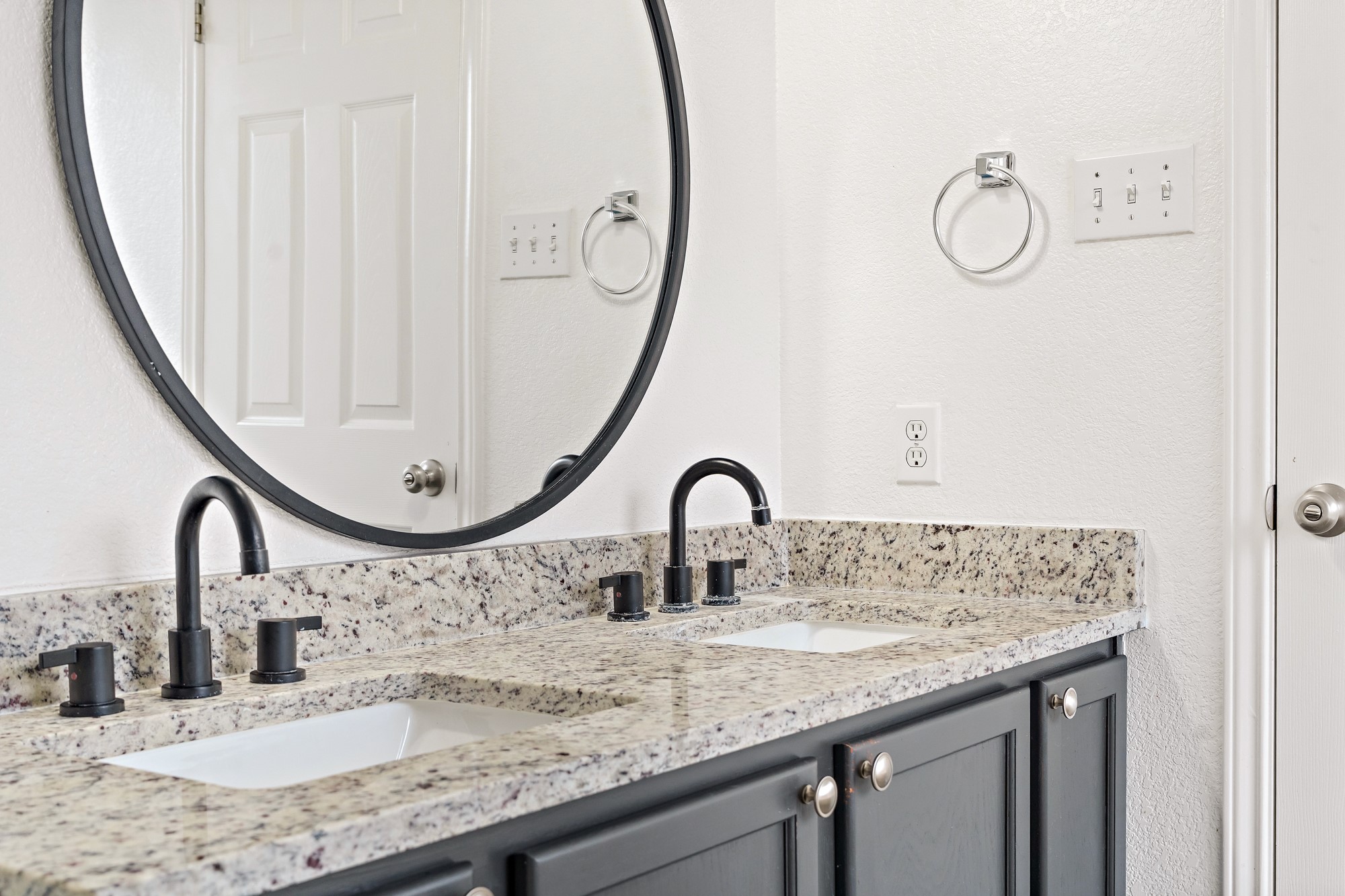 321 Nicole Way Bastrop, TX 78602 - Photo 23 of 32 Full bathroom featuring double vanity and a textured wall