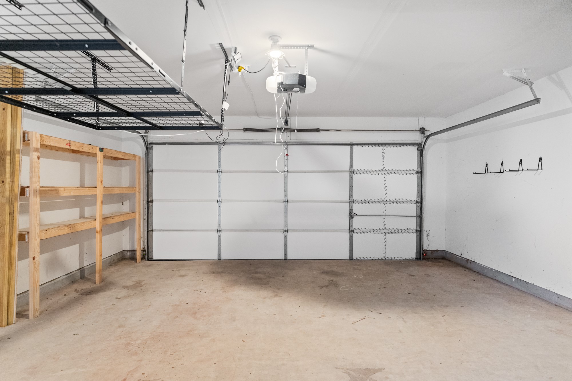 321 Nicole Way Bastrop, TX 78602 - Photo 25 of 32 Garage with baseboards and a garage door opener