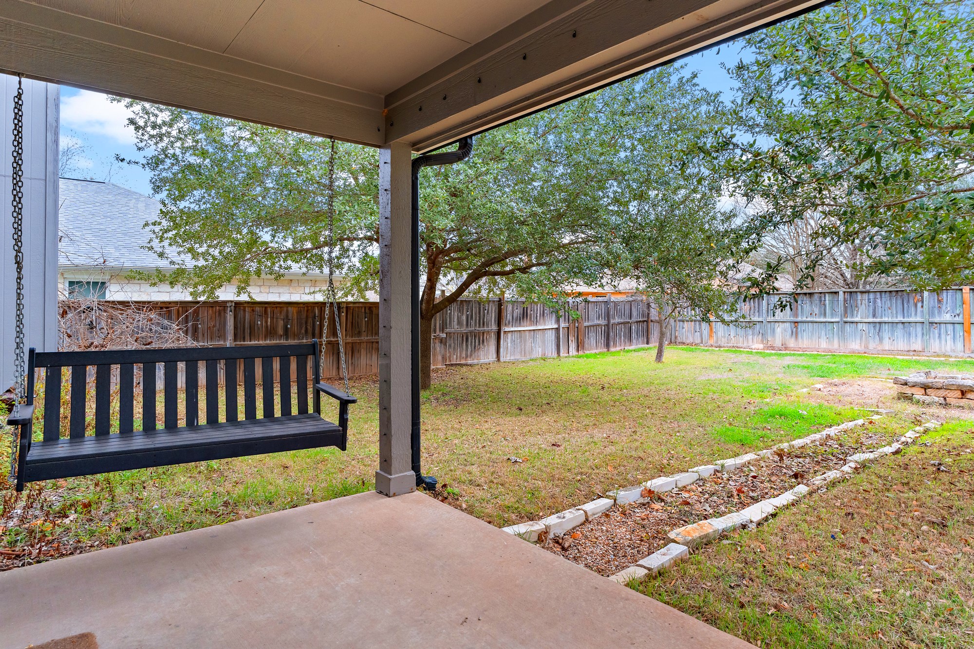 321 Nicole Way Bastrop, TX 78602 - Photo 27 of 32 Fenced backyard featuring a patio area