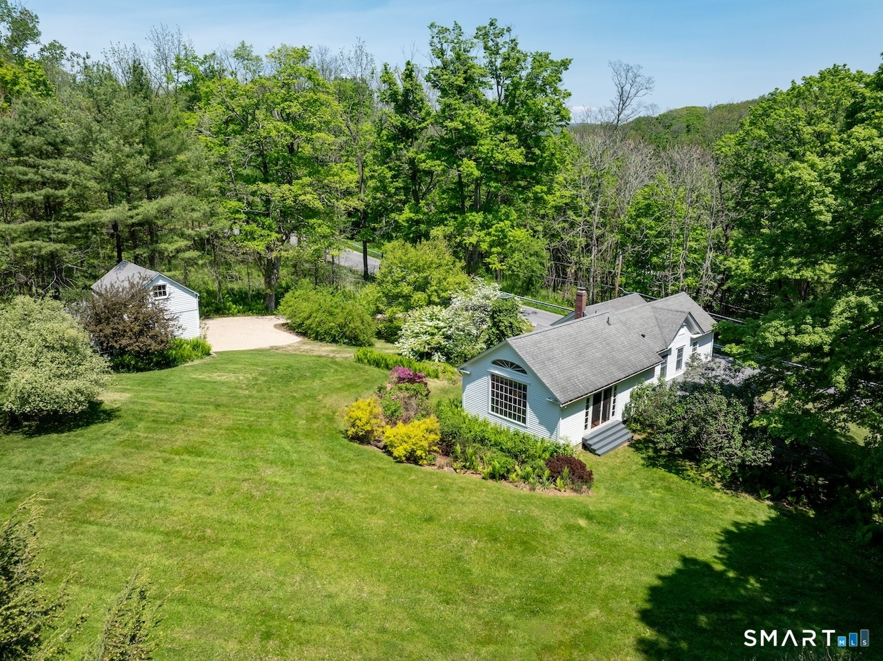 329 Housatonic River Road Salisbury, CT 06031 - Photo 23 of 32 a view of a house with a yard