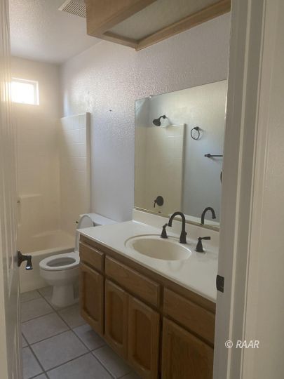 516 Amanda Street Ridgecrest, CA 93555 - Photo 8 of 9 a bathroom with a sink toilet and shower