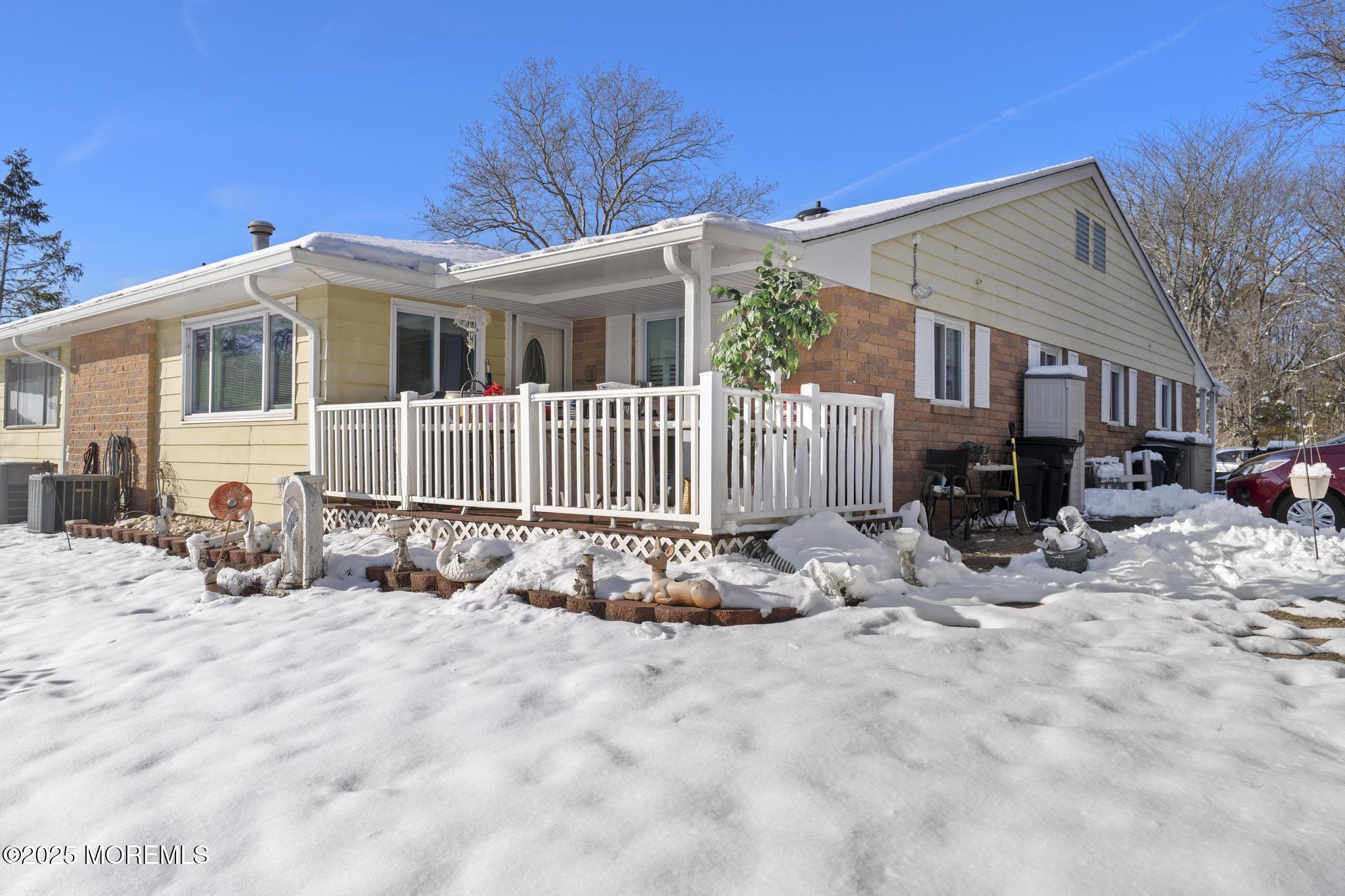 6 C Swallow Street Jackson, NJ 08527 - Photo 12 of 12 a view of a house with a yard covered in snow