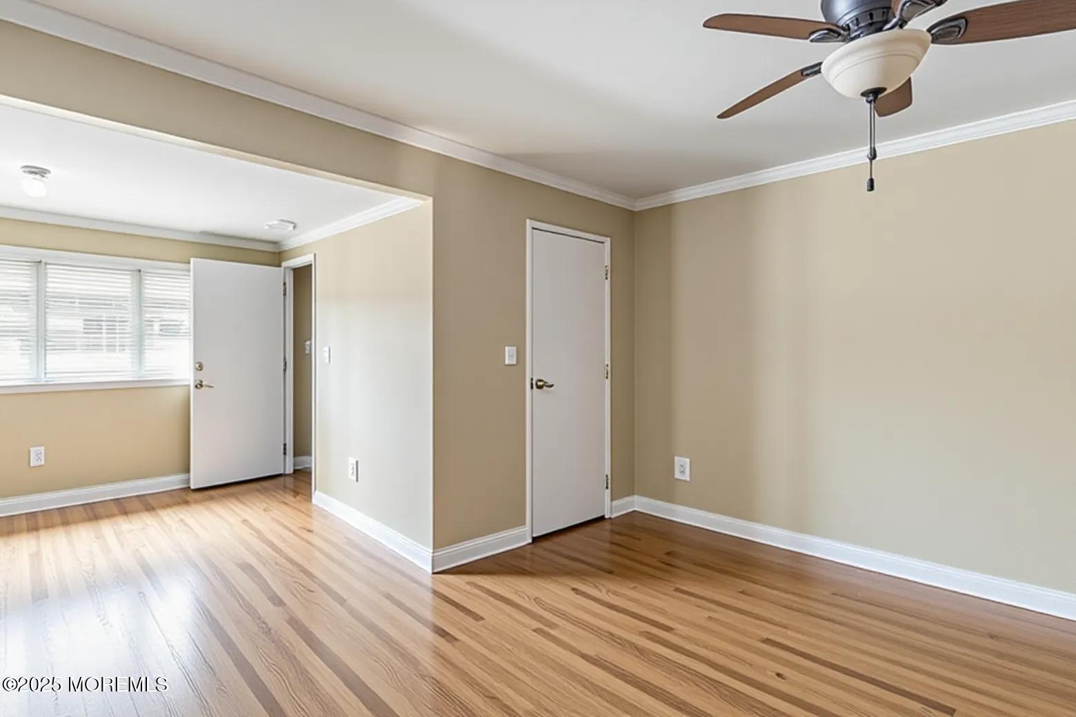 6 C Swallow Street Jackson, NJ 08527 - Photo 5 of 12 wooden floor in an empty room with a window
