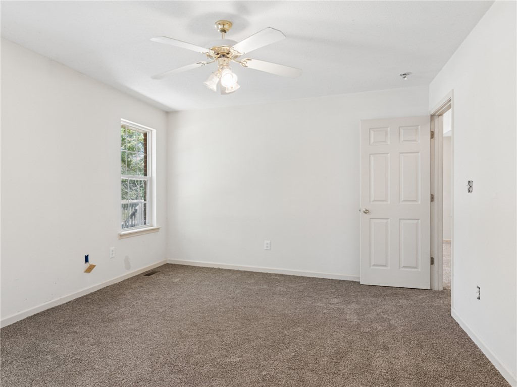 101 Woodbridge Circle Anderson, SC 29621 - Photo 13 of 21 A spacious room with natural light and a soft carpet awaits your personal touch.
