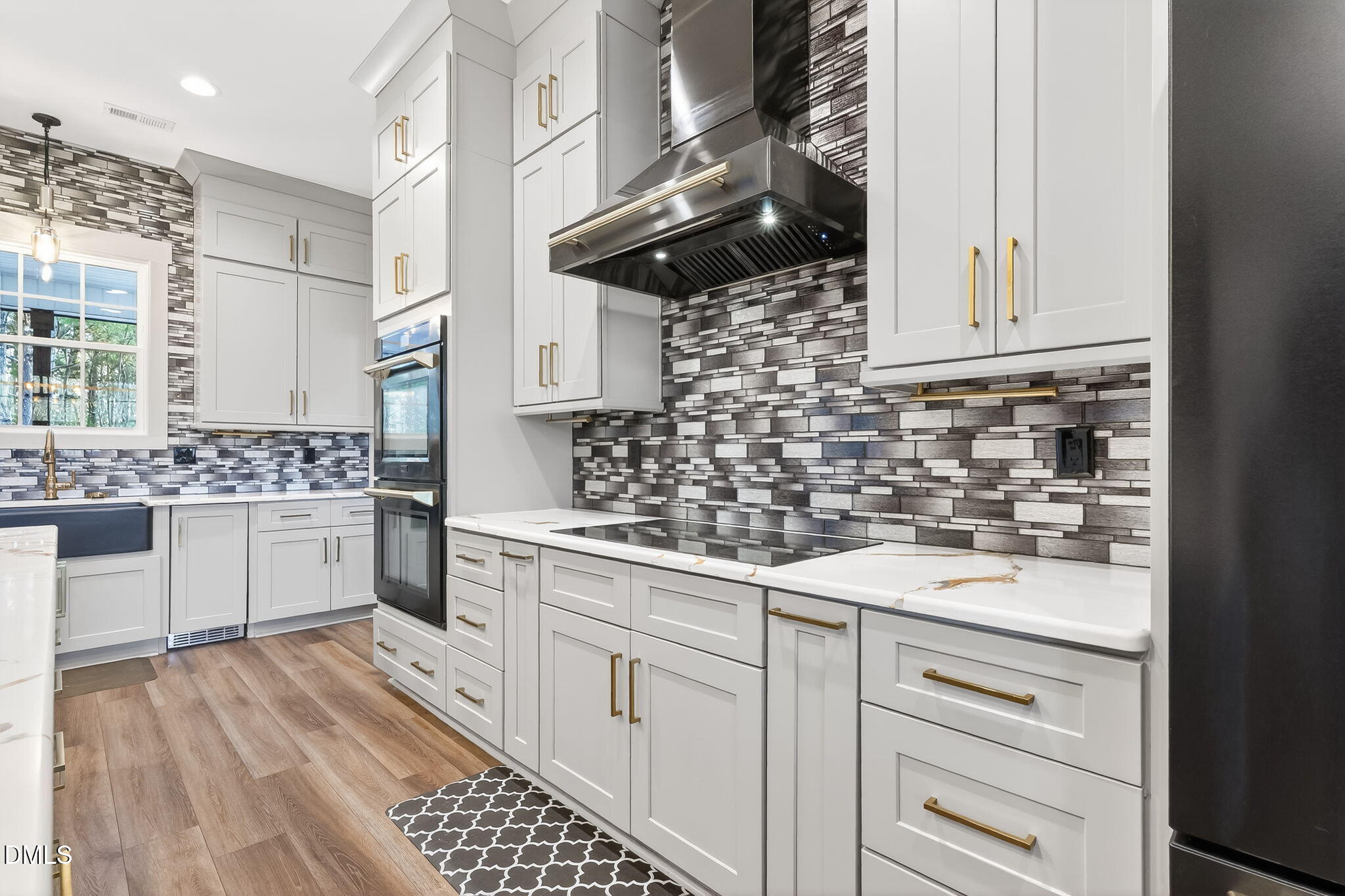 260 Freedom Road Smithfield, NC 27577 - Photo 17 of 75 a kitchen with white cabinets and appliances