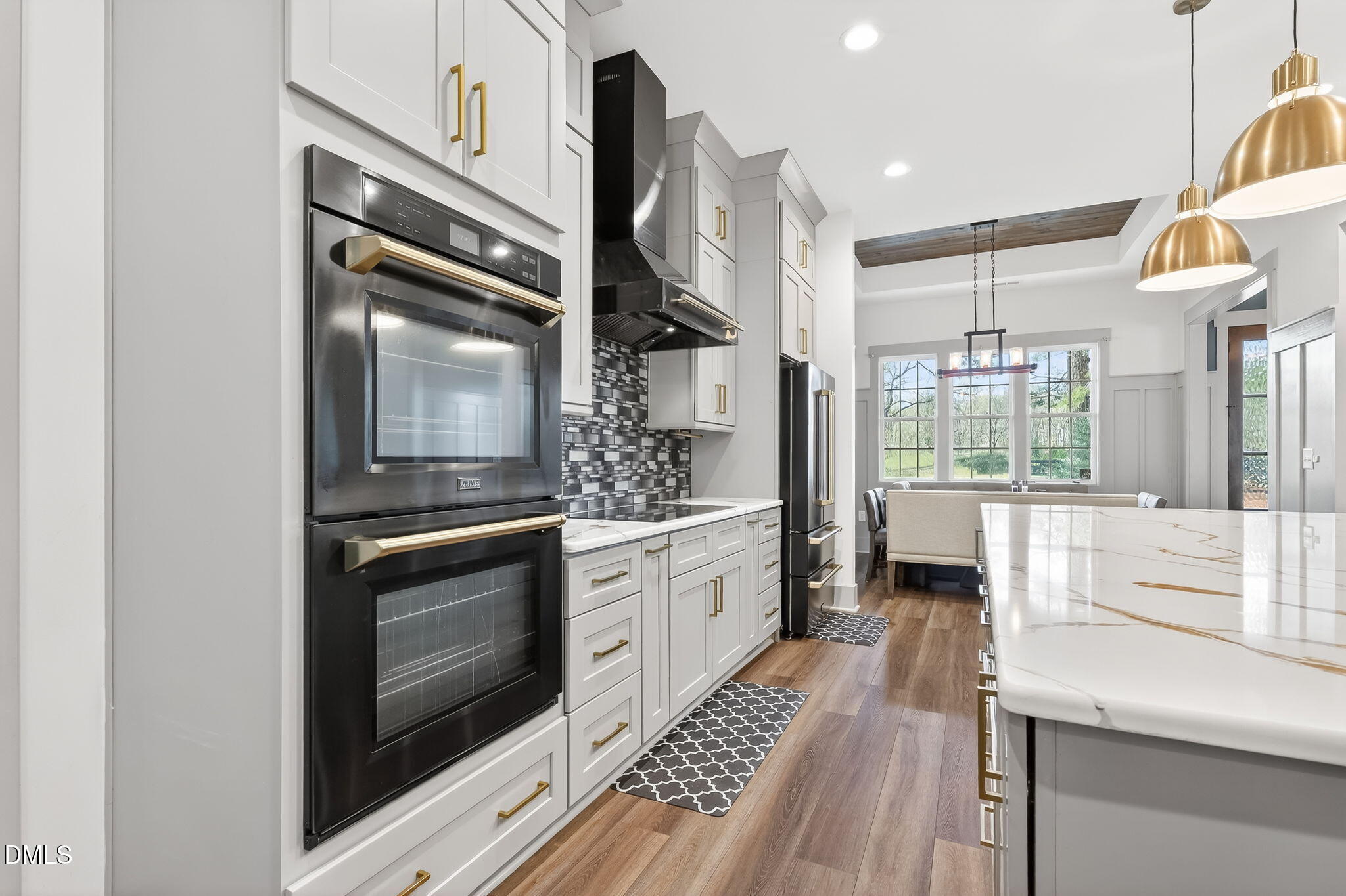 260 Freedom Road Smithfield, NC 27577 - Photo 21 of 75 a kitchen with stainless steel appliances granite countertop a stove a sink and a microwave
