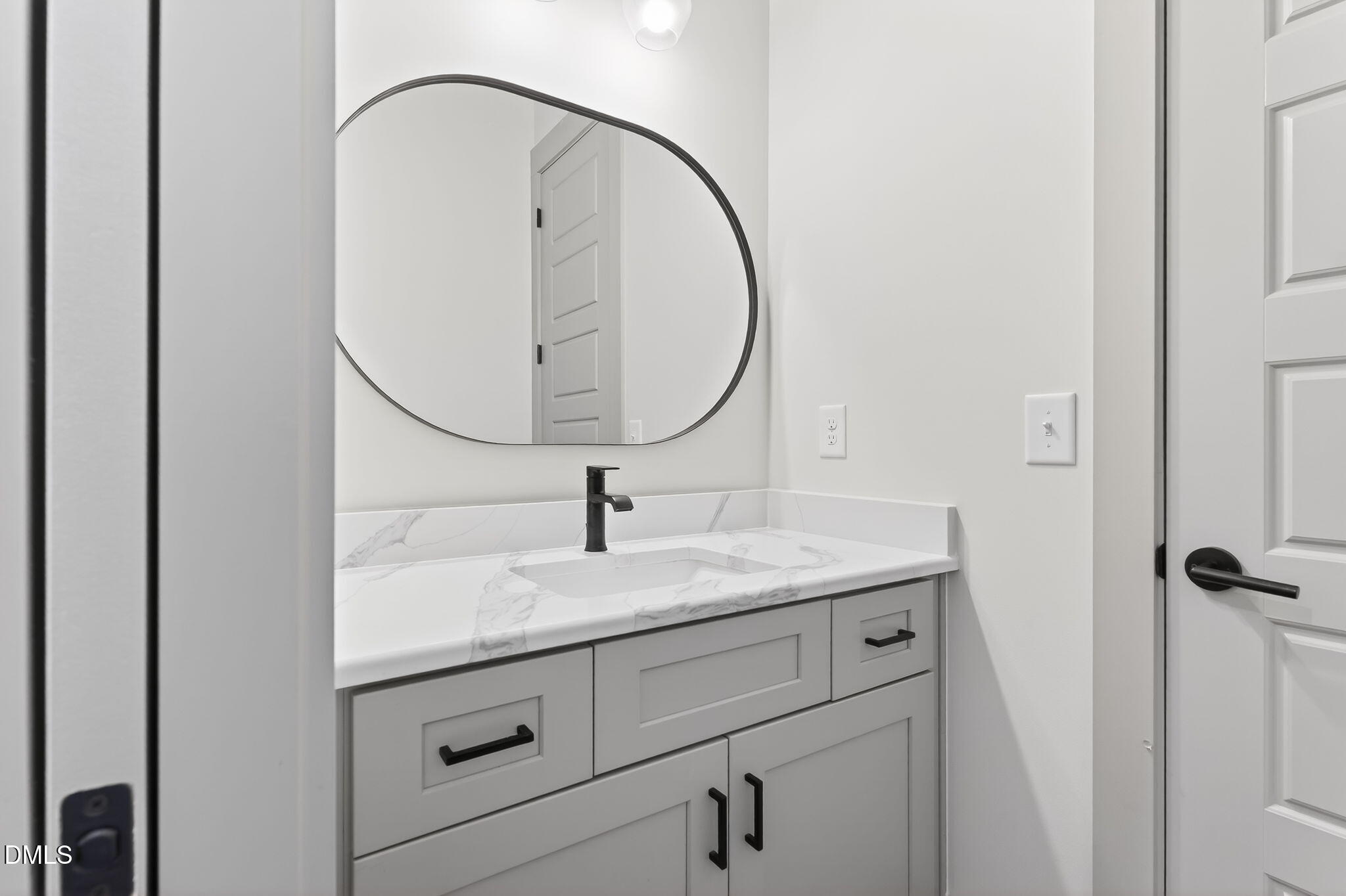 260 Freedom Road Smithfield, NC 27577 - Photo 37 of 75 a bathroom with a granite countertop sink and mirror