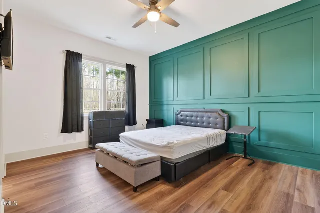 a bedroom with a bed and a stove top oven