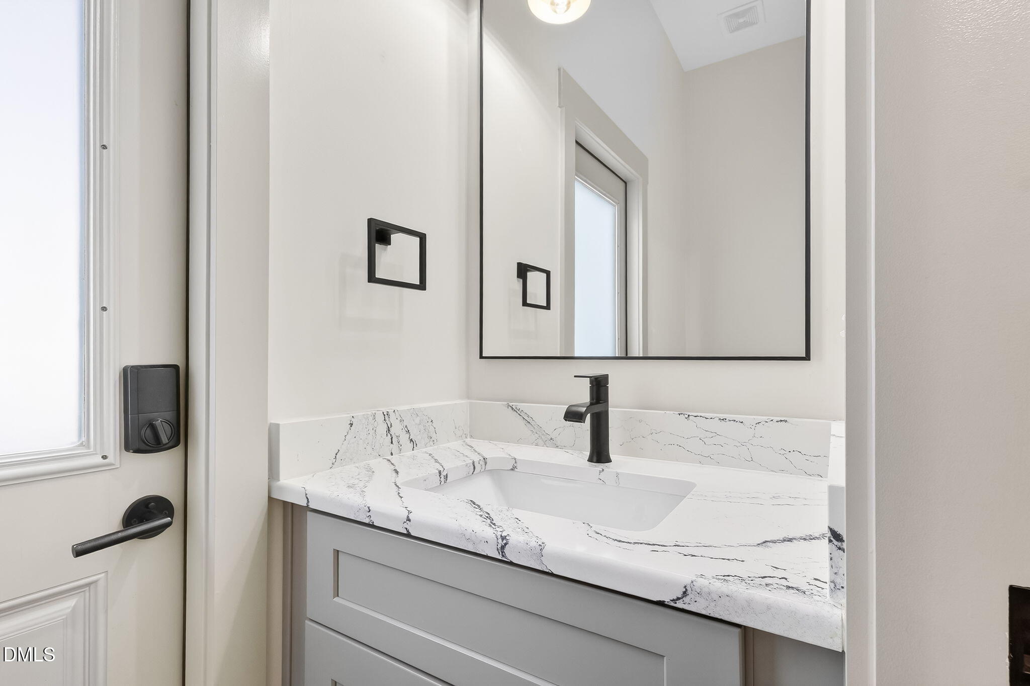 260 Freedom Road Smithfield, NC 27577 - Photo 46 of 75 a bathroom with a granite countertop sink and a mirror