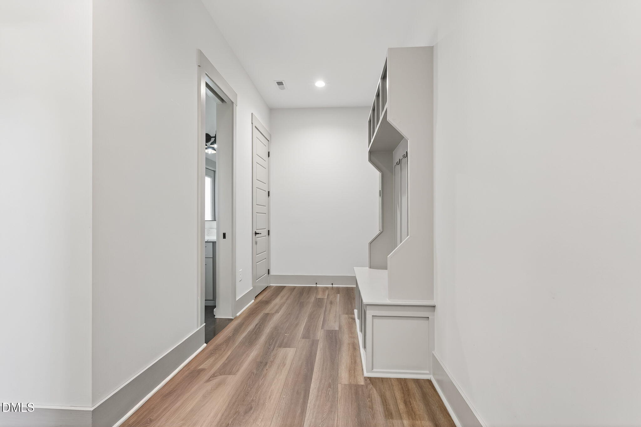 260 Freedom Road Smithfield, NC 27577 - Photo 47 of 75 a view of a room with wooden floor and white walls