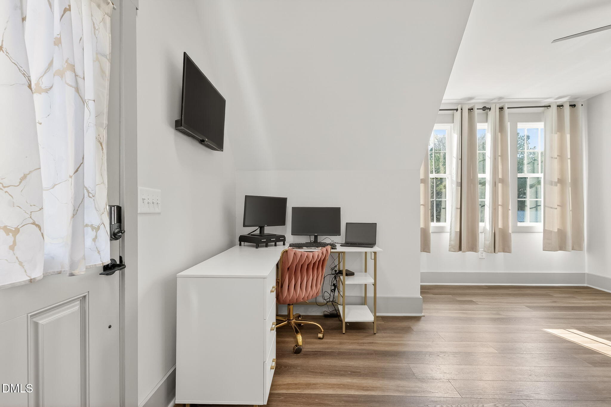 260 Freedom Road Smithfield, NC 27577 - Photo 50 of 75 a view of a workspace with furniture and a flat screen tv