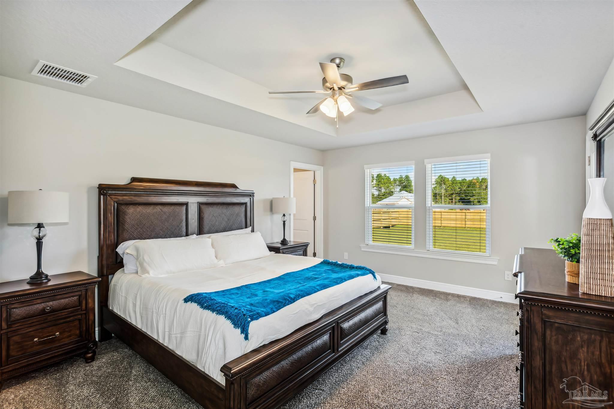 4835 Horace Lunsford Road Milton, FL 32570 - Photo 9 of 20 a bedroom with a bed and window