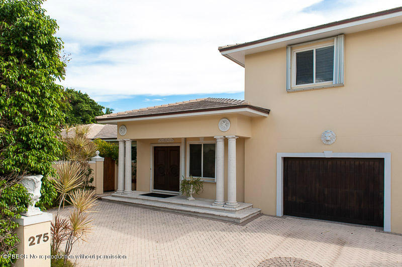 275 North County Road Palm Beach, FL 33480 - Photo 1 of 15 a front view of a house with a garage