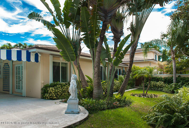 275 North County Road Palm Beach, FL 33480 - Photo 14 of 15 a view of a house with a yard and potted plants