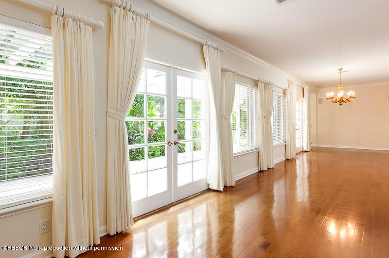 275 North County Road Palm Beach, FL 33480 - Photo 6 of 15 a view of an empty room with wooden floor and a window