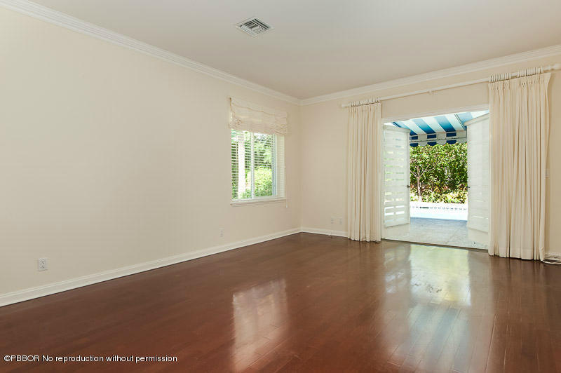 275 North County Road Palm Beach, FL 33480 - Photo 8 of 15 an empty room with wooden floor and windows