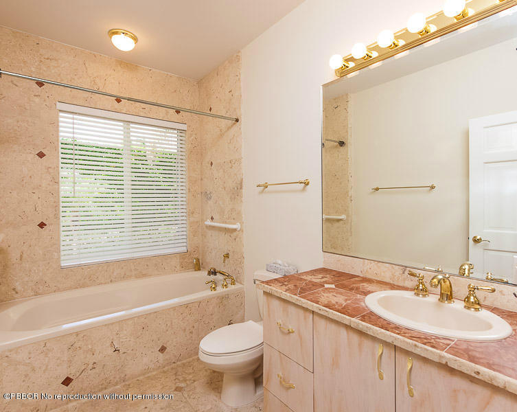 275 North County Road Palm Beach, FL 33480 - Photo 10 of 15 a bathroom with a granite countertop sink toilet mirror and bathtub