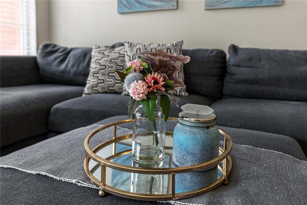 8558 Crystal Cove Loop Kissimmee, FL 34747 - Photo 17 of 35 a living room with furniture flowerpot and a chandelier