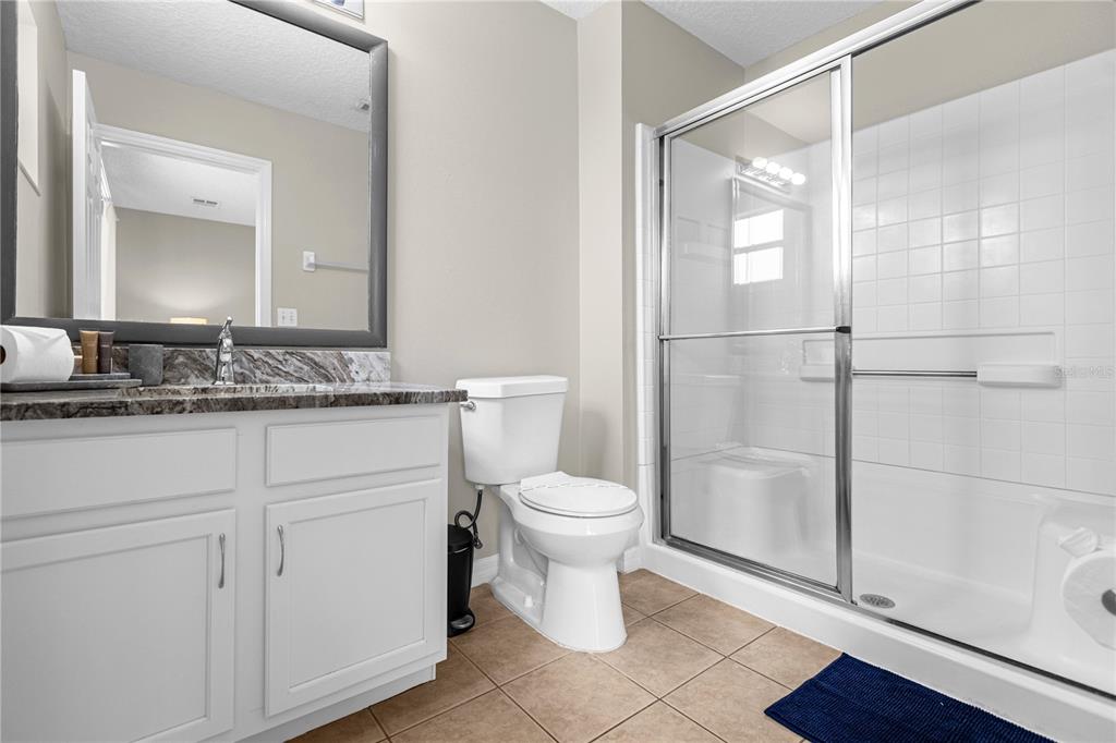 8558 Crystal Cove Loop Kissimmee, FL 34747 - Photo 23 of 35 a bathroom with a sink toilet and shower