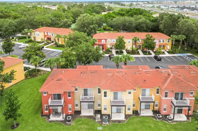 a view of a house with yard and sitting area