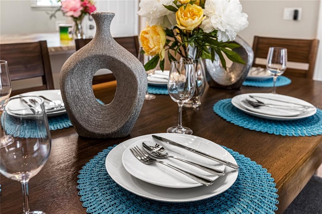 8558 Crystal Cove Loop Kissimmee, FL 34747 - Photo 7 of 35 a dining room with furniture and wooden floor