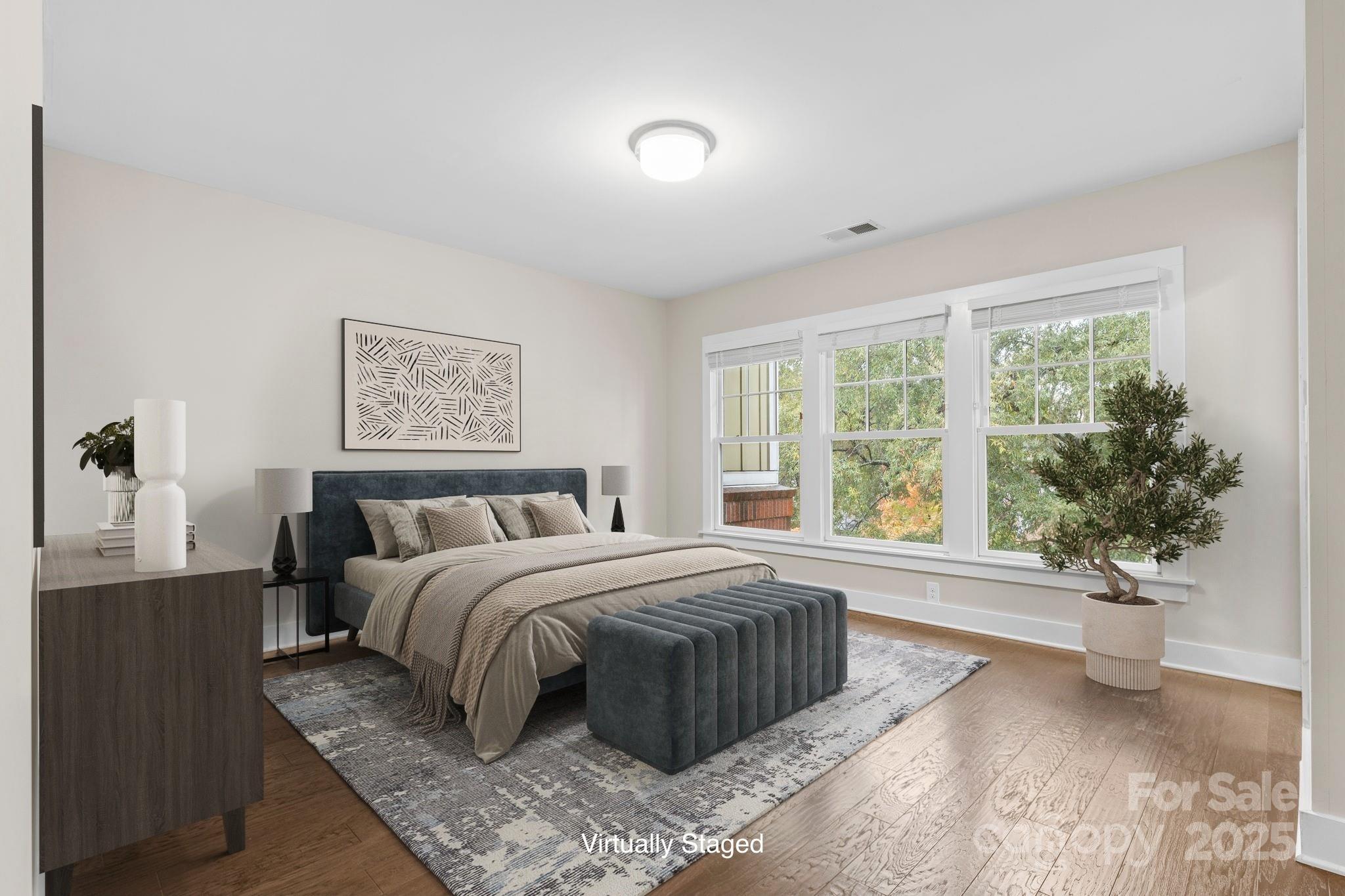 129 Grandin Road Charlotte, NC 28208 - Photo 22 of 35 a bedroom with a large bed and a large window