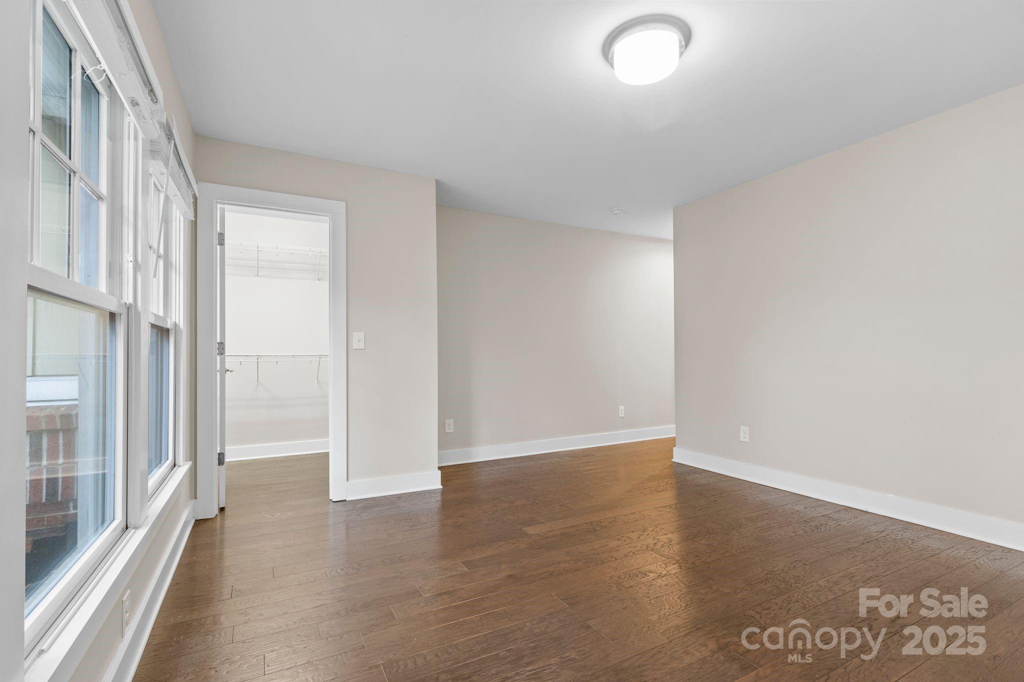 129 Grandin Road Charlotte, NC 28208 - Photo 24 of 35 wooden floor in an empty room with a window