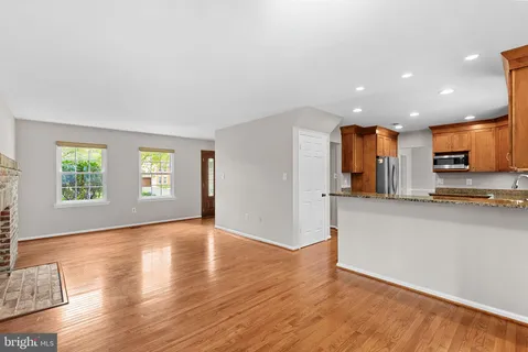a view of a kitchen with a sink and a window