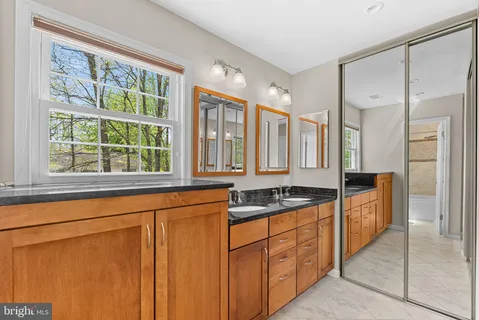 a kitchen with stainless steel appliances granite countertop a stove and a sink