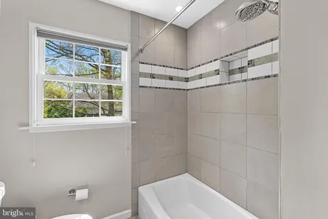 a bathroom with a shower and a bathtub