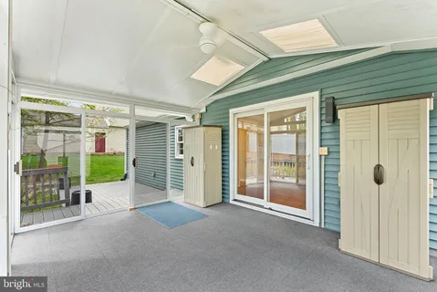 a view of an entryway with wooden floor