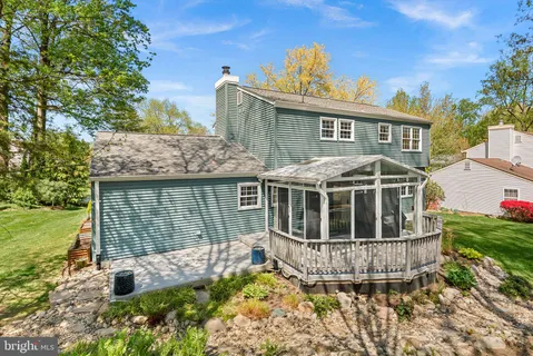 a front view of a house with a garden and yard
