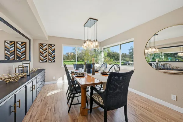 a view of a dining room with furniture window and wooden floor