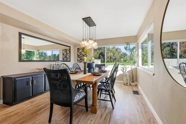 a kitchen with sink cabinets and wooden floor