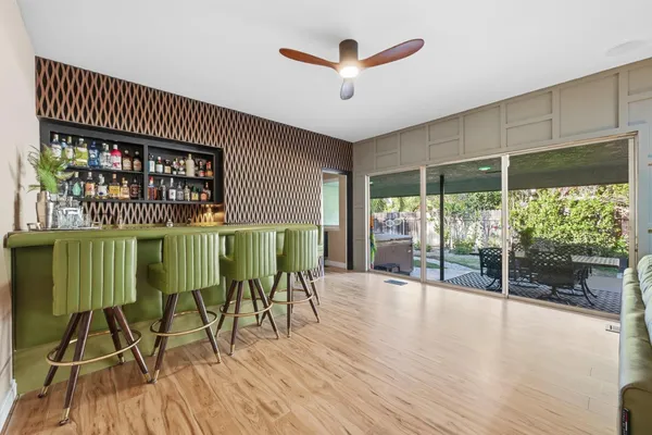 a dining room with furniture and wooden floor