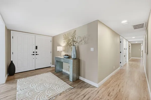 a bedroom with furniture and a window