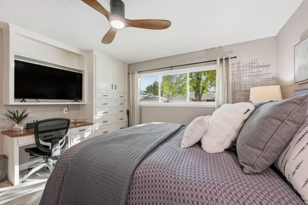 a bedroom with furniture and a window
