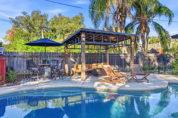 a view of a chairs and table in the patio