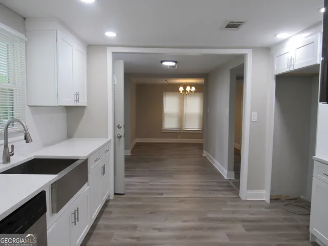 a bathroom with a toilet a sink