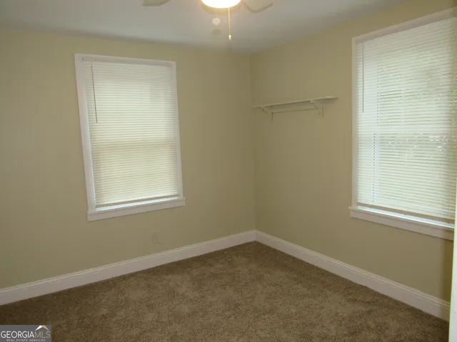 a room with furniture and a window